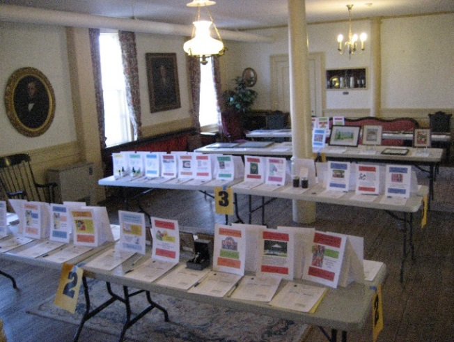 silent auction bidding setup on tables in the church