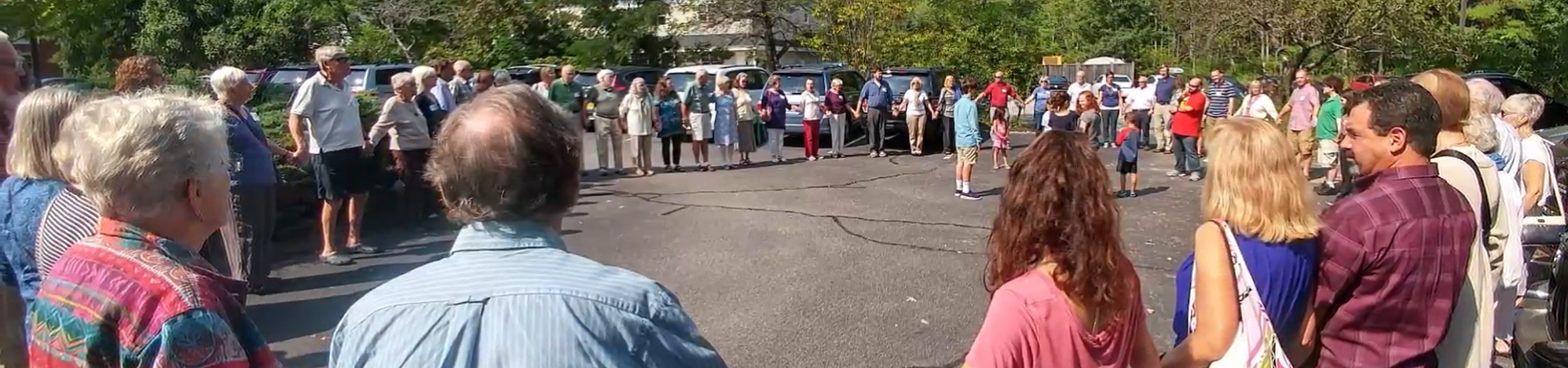 Outside circle gathering to honor the children